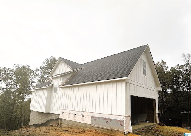 view of property exterior featuring an outbuilding and a garage