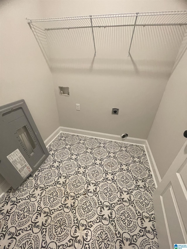 laundry room featuring hookup for a washing machine, light tile patterned floors, and electric dryer hookup