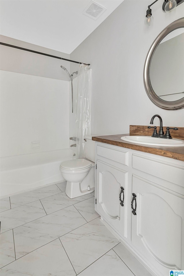 full bathroom featuring toilet, vanity, and shower / tub combo