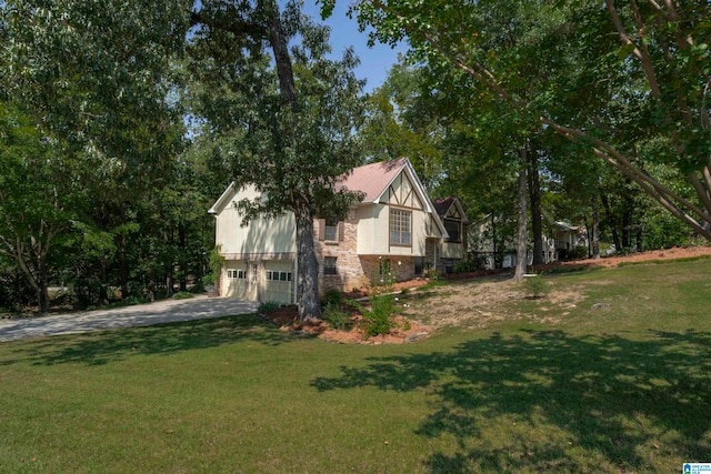 view of property exterior with a yard and a garage