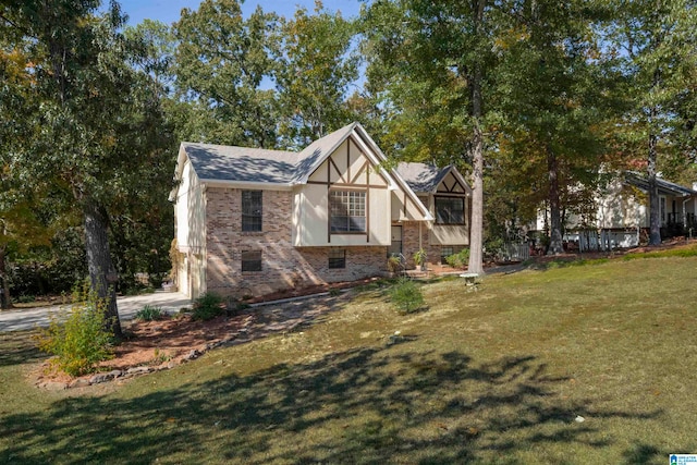 view of side of home with a yard