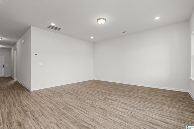 spare room featuring hardwood / wood-style flooring