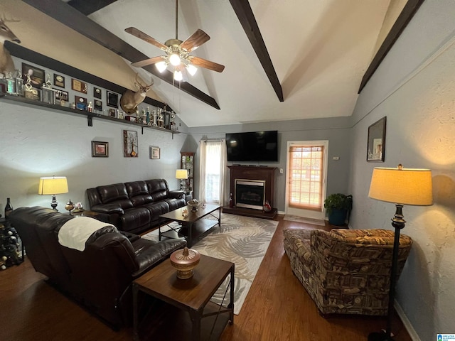 living room with lofted ceiling with beams, wood-type flooring, and ceiling fan