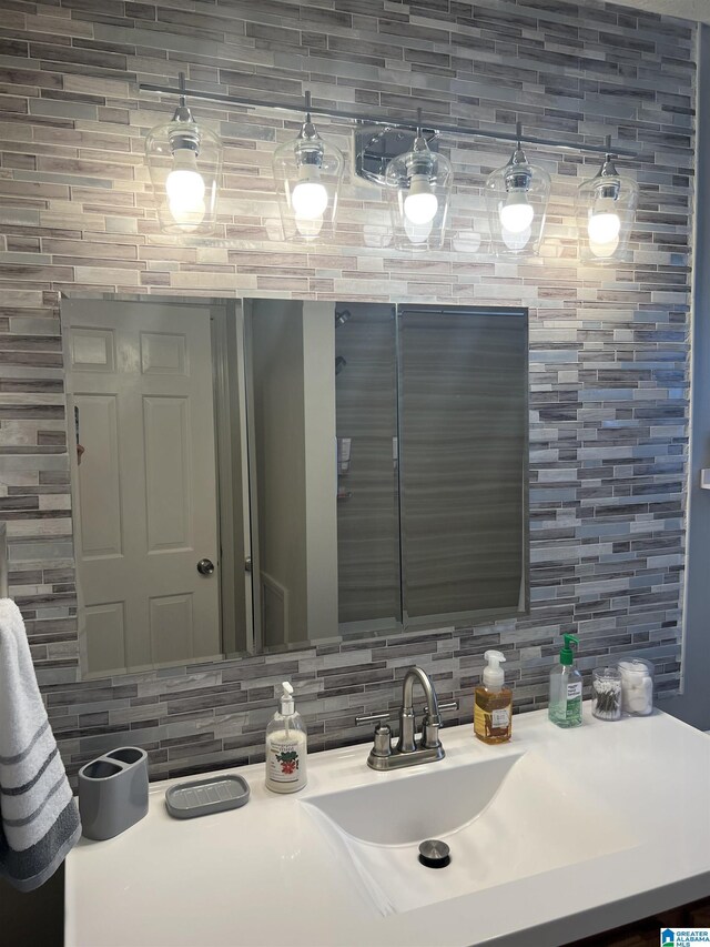 bathroom with vanity and backsplash