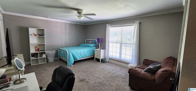 bedroom featuring ornamental molding, ceiling fan, and carpet floors