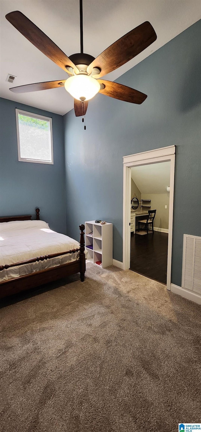 unfurnished bedroom with ceiling fan, visible vents, and carpet floors