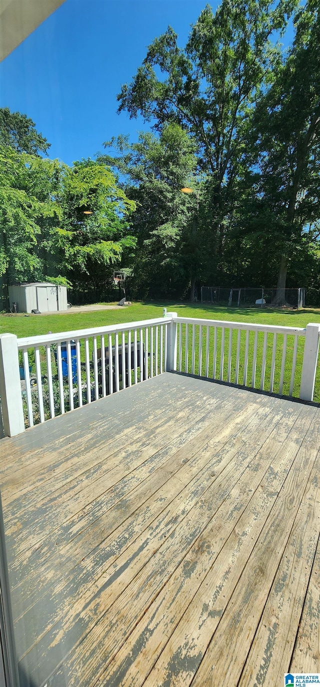 view of front of home with a shingled roof, a porch, a garage, a front lawn, and driveway