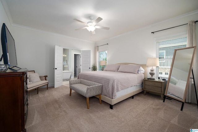 bedroom with ceiling fan, ensuite bath, carpet floors, and multiple windows