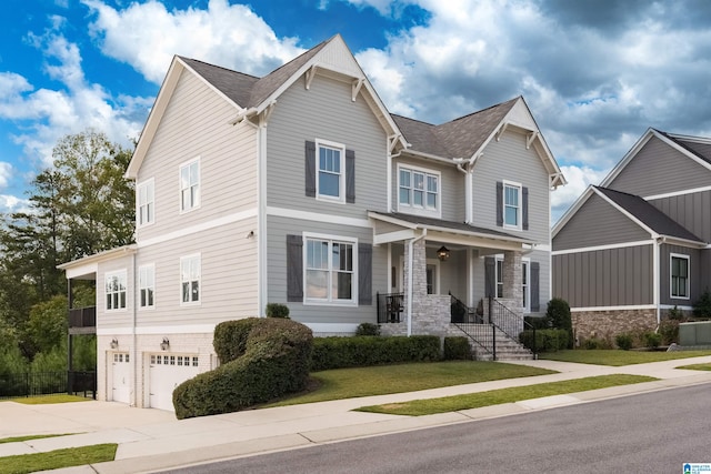 craftsman-style home with a garage and covered porch