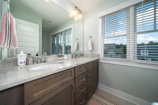 bathroom with vanity and tile patterned floors