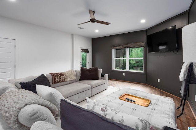 living room featuring hardwood / wood-style flooring and ceiling fan