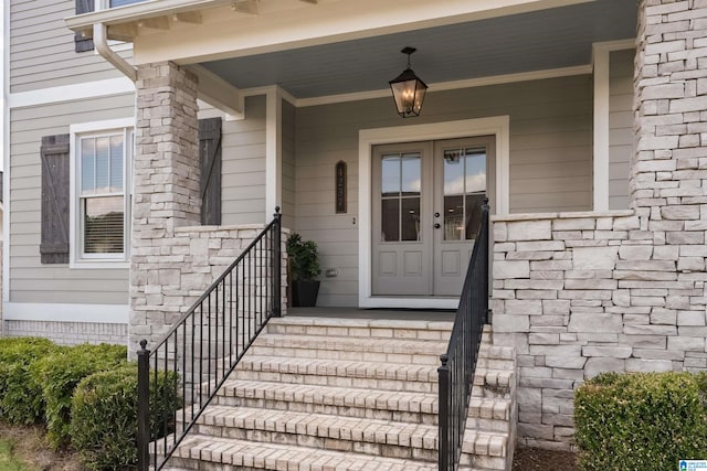 view of exterior entry featuring a porch