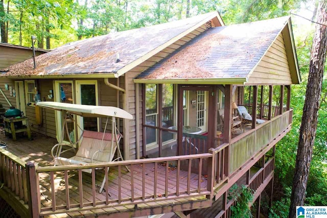 rear view of property with a deck