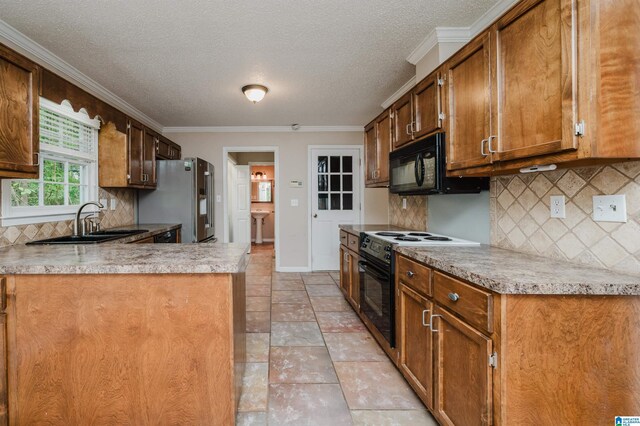 kitchen with ornamental molding, backsplash, black appliances, kitchen peninsula, and sink