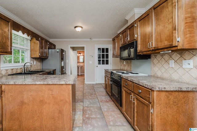 3424 Oakdale Dr, Vestavia Hills, AL 35223 - kitchen featuring black appliances, crown molding, light countertops, and a sink
