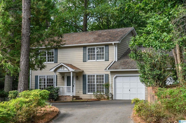 3424 Oakdale Dr, Vestavia Hills, AL 35223 - colonial house with an attached garage, driveway, and a shingled roof