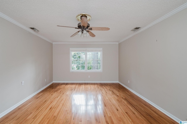 unfurnished room featuring light wood-type flooring, ceiling fan, ornamental molding, and a textured ceiling