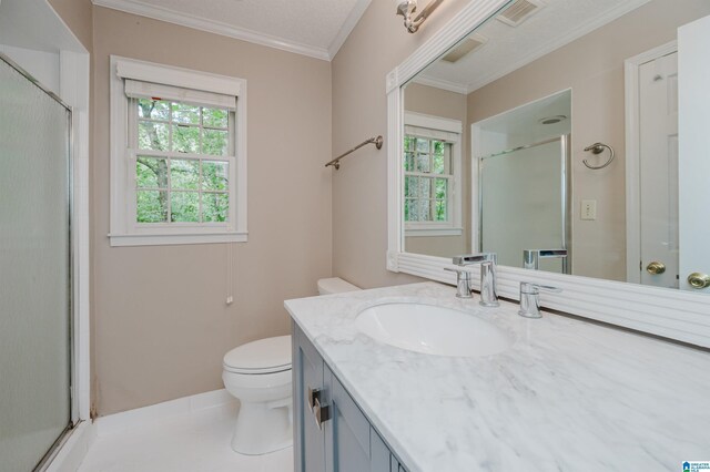 bathroom with ornamental molding, vanity, toilet, and walk in shower