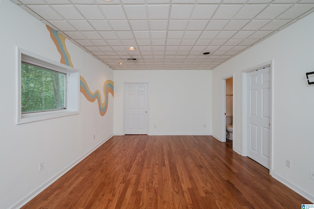 3424 Oakdale Dr, Vestavia Hills, AL 35223 - empty room featuring a drop ceiling, baseboards, and wood finished floors