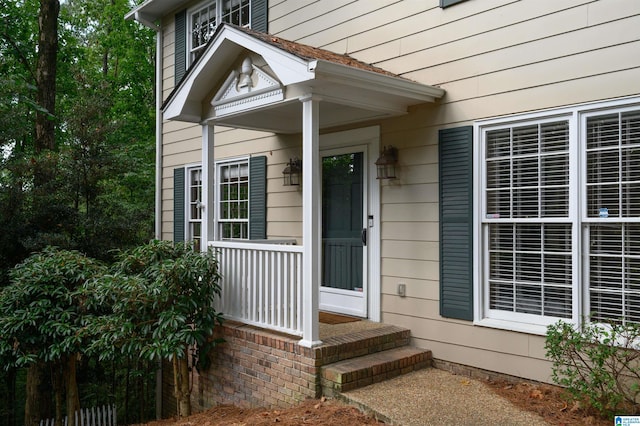 entrance to property featuring a porch