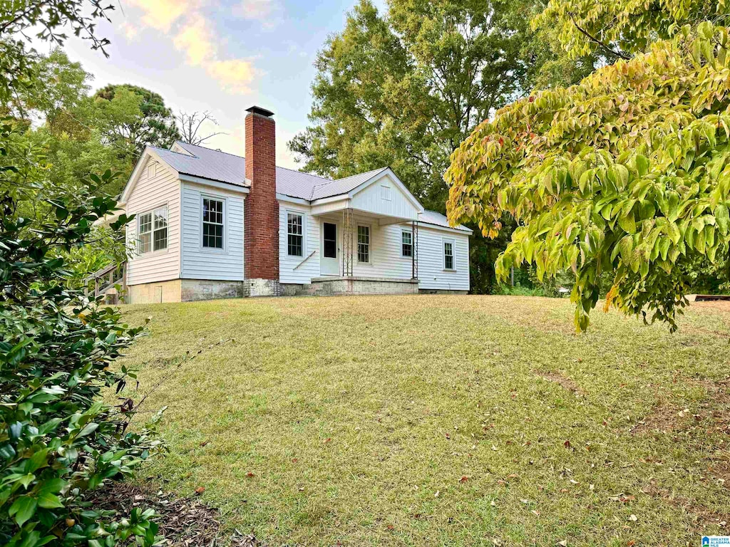 back of house with a yard