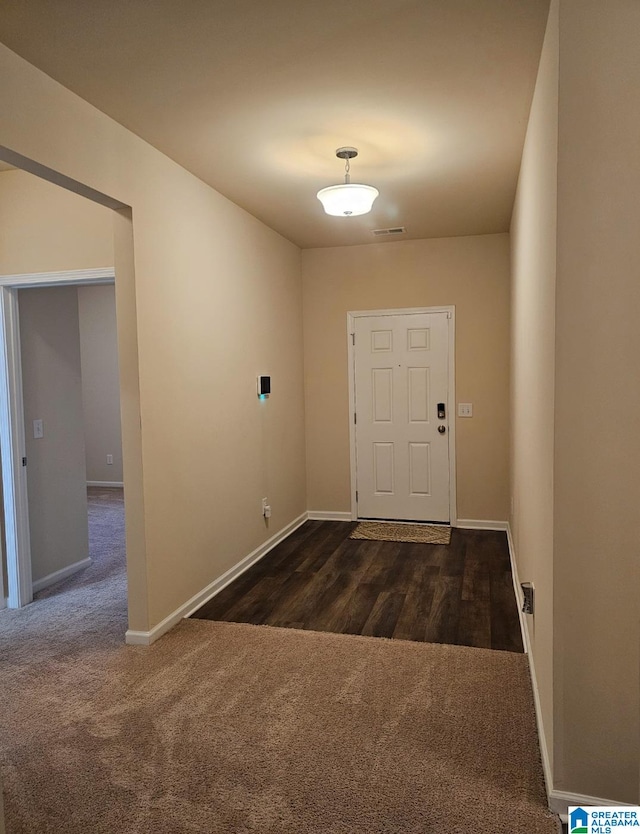 foyer featuring dark wood-type flooring