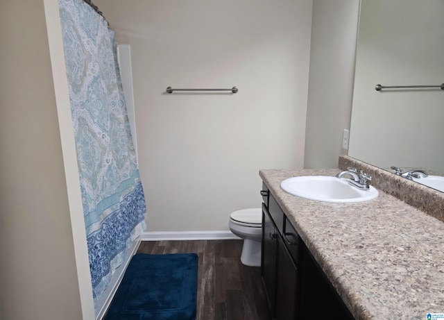 full bathroom featuring vanity, toilet, shower / bathtub combination with curtain, and hardwood / wood-style flooring