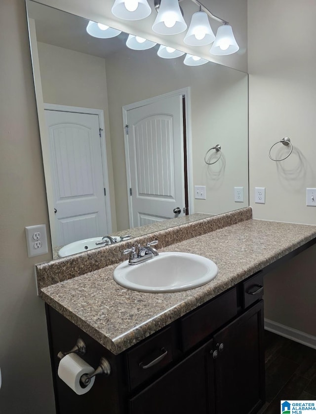 bathroom featuring wood-type flooring and vanity