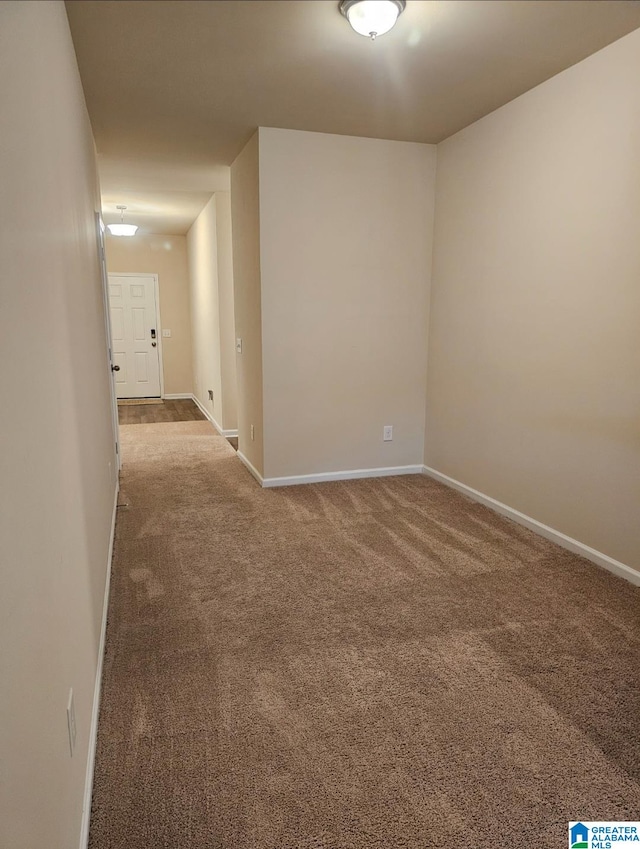 unfurnished room with carpet floors