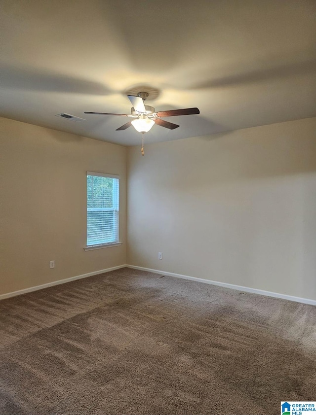 empty room featuring ceiling fan and carpet flooring