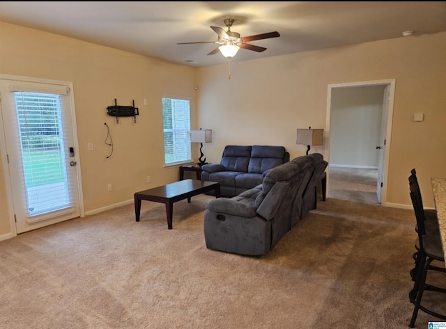 living room with carpet flooring and ceiling fan