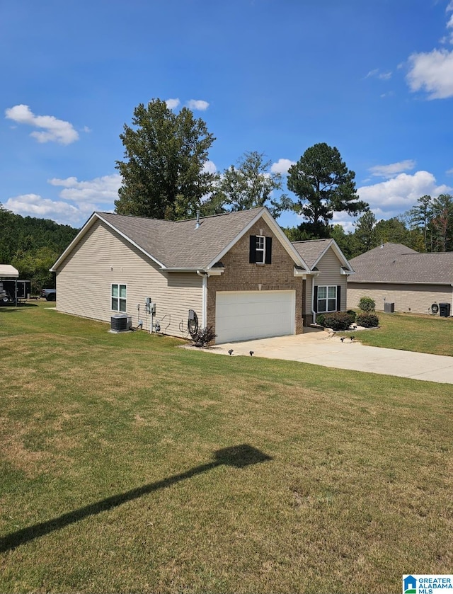 ranch-style house featuring a garage, central AC, and a front yard