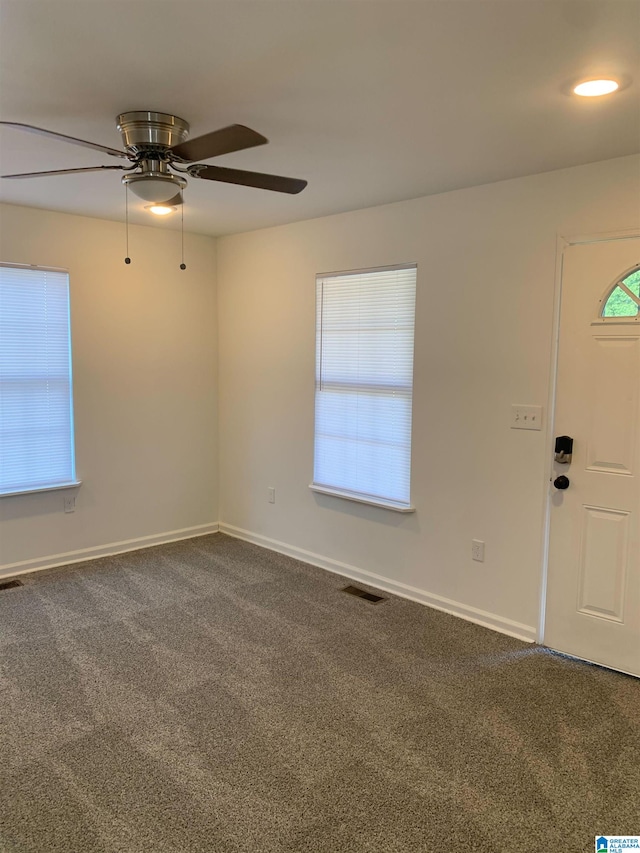 unfurnished room featuring carpet flooring and ceiling fan