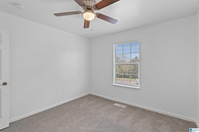 empty room with carpet floors and ceiling fan