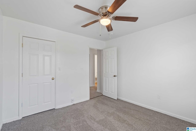 unfurnished bedroom with ceiling fan and light carpet