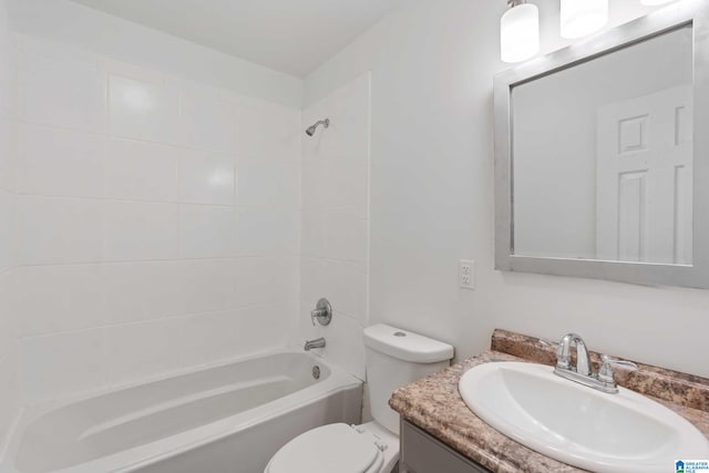 full bathroom with vanity, toilet, and tiled shower / bath combo