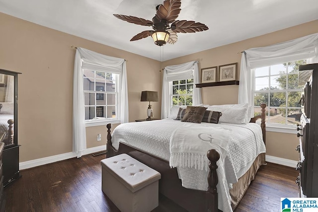 bedroom featuring dark hardwood / wood-style flooring and ceiling fan