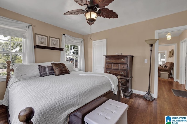 bedroom featuring ceiling fan and dark hardwood / wood-style flooring