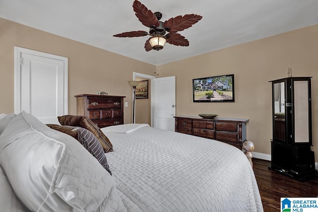 bedroom with ceiling fan and dark hardwood / wood-style floors