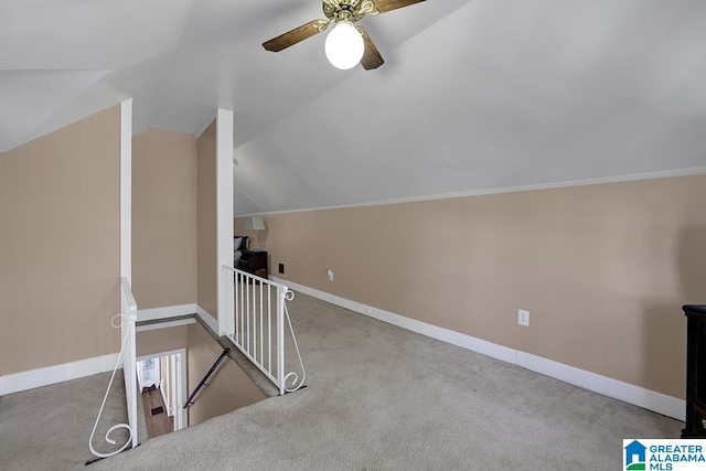 bonus room with lofted ceiling, ceiling fan, and carpet flooring