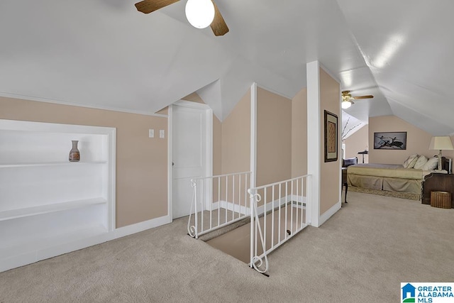 bonus room featuring lofted ceiling, light colored carpet, and ceiling fan