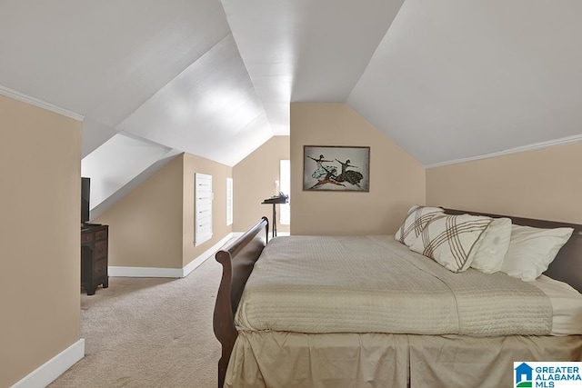 carpeted bedroom with lofted ceiling