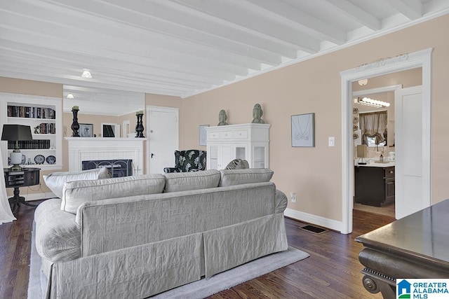 949 44th St, Birmingham, AL 35208 - living area with beam ceiling, a fireplace, dark wood-style floors, baseboards, and visible vents