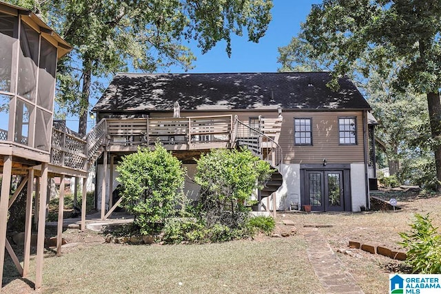 back of property featuring a wooden deck