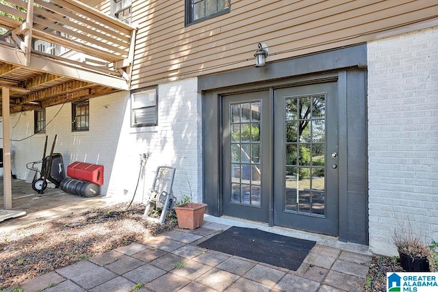 entrance to property featuring french doors