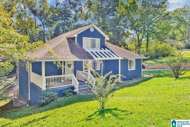 view of front property with a porch and a front yard