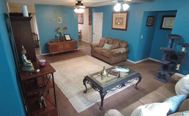 carpeted living room with ceiling fan