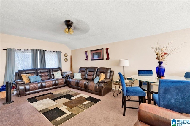 living room with carpet flooring, a textured ceiling, and vaulted ceiling