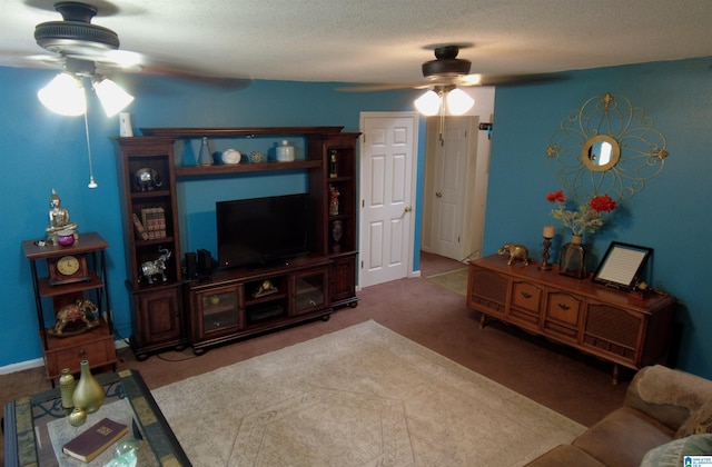 carpeted living room with ceiling fan and a textured ceiling