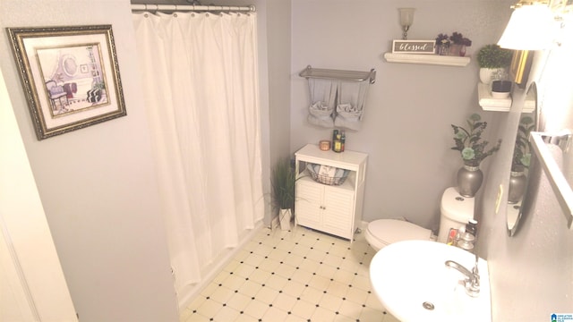 bathroom featuring toilet